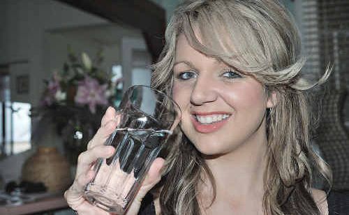 Tara Brown of Maryborough enjoys a glass of water at her home yesterday. Tara Brown of Maryborough enjoys a glass of water at her home yesterday.